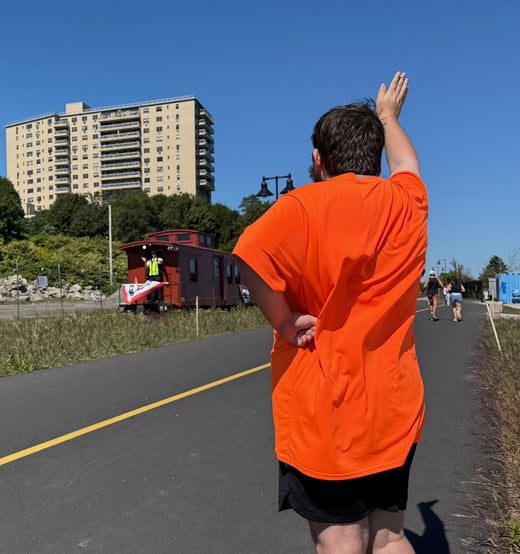 FC waving at the train