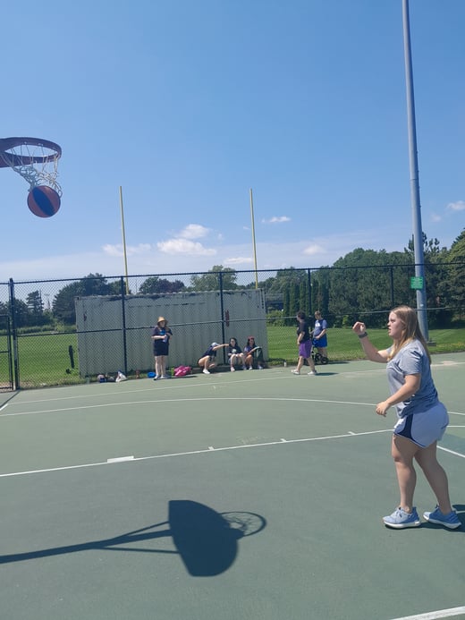 SK, group in background - basketball